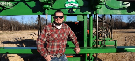 Joe Williams in front of the Tremor Drilling Mast